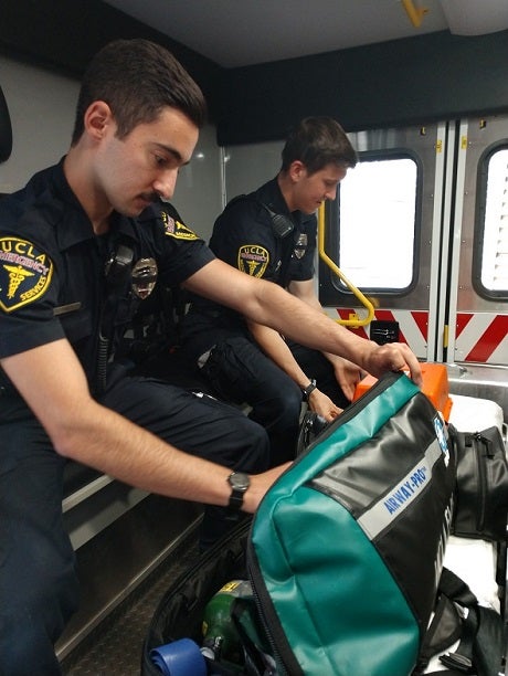 EMT Cliff Danza and EMT Matt Guarino check the gear in EMS-1, UCLA's ambulance unit.