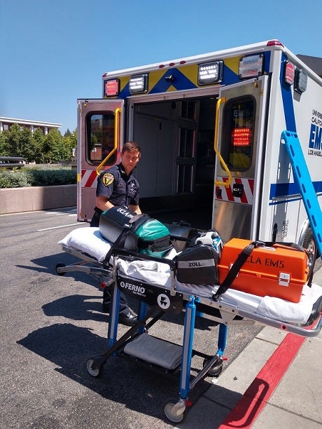EMT Matt Guarino loads equipment into EMS-1, UCLA's ambulance unit. 