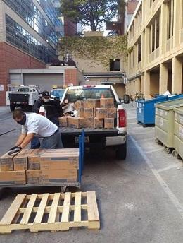 Staff preparing to deliver hundreds of boxes of products to Engineering.  