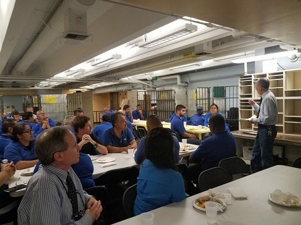 MDDS Director David Aberbuch addresses staff at a pizza party in July 2019.