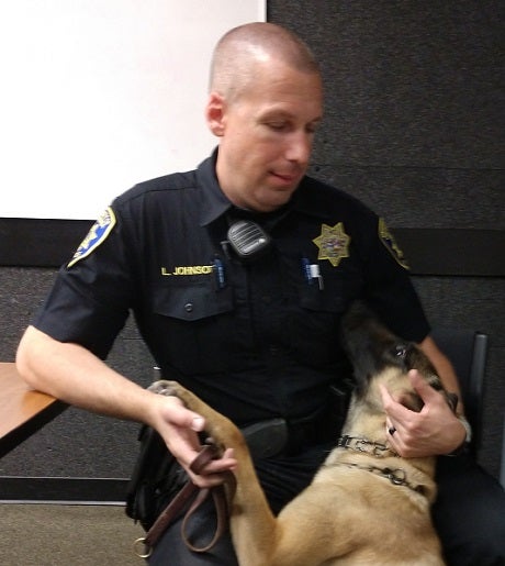 K-9 Officer Blake is clearly devoted to his partner, Officer Larry Johnson.