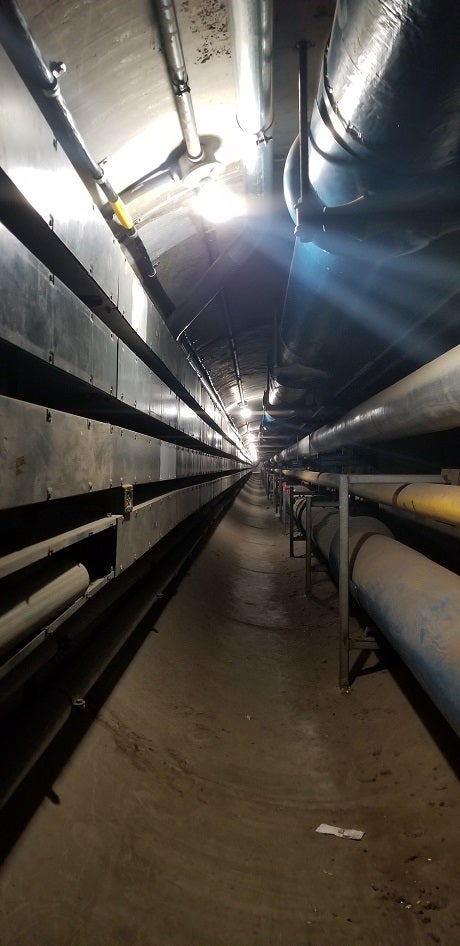 An underground cylindrical tunnel beneath campus.